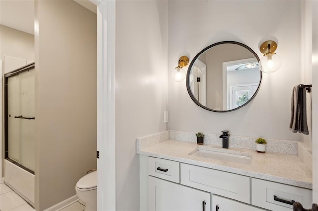 2721 Old Concord Rd SE, Smyrna, GA 30082 - full bathroom featuring toilet, vanity, tile patterned flooring, and enclosed tub / shower combo