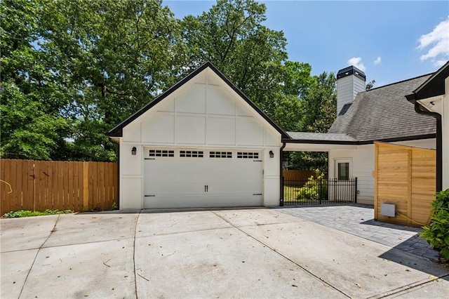 2721 Old Concord Rd SE, Smyrna, GA 30082 - garage with concrete driveway and fence