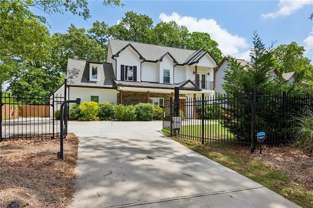 2721 Old Concord Rd SE, Smyrna, GA 30082 - modern farmhouse with a fenced front yard, a gate, and concrete driveway