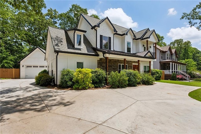 2721 Old Concord Rd SE, Smyrna, GA 30082 - view of front of home with fence, board and batten siding, and a shingled roof