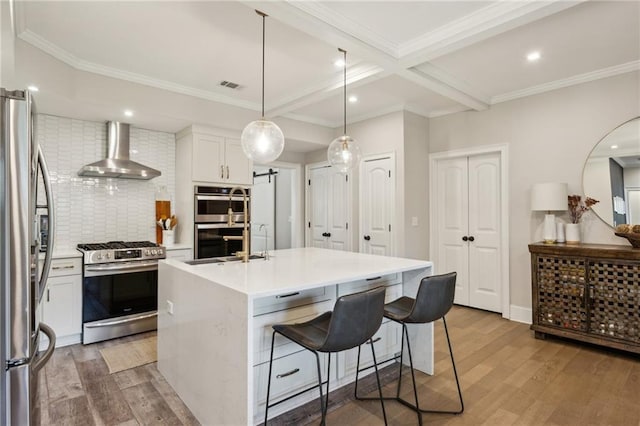 2721 Old Concord Rd SE, Smyrna, GA 30082 - kitchen featuring wall chimney exhaust hood, stainless steel appliances, a sink, light wood-type flooring, and backsplash