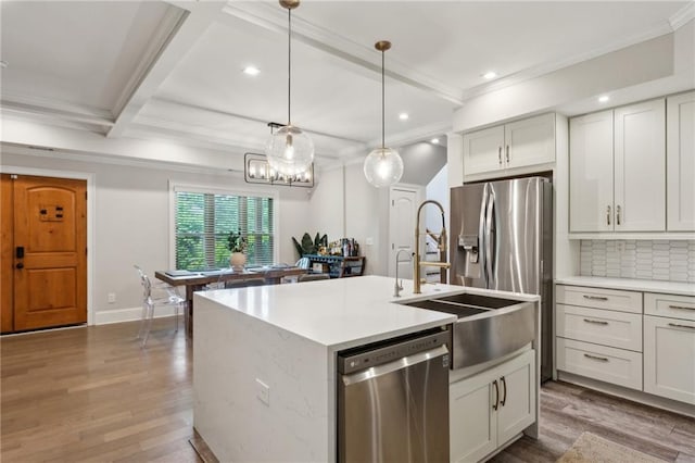 2721 Old Concord Rd SE, Smyrna, GA 30082 - kitchen featuring stainless steel dishwasher, a sink, wood finished floors, crown molding, and recessed lighting