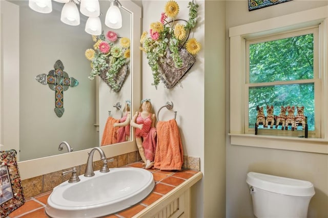 half bathroom with toilet and vanity