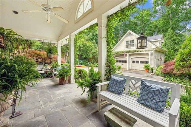 view of patio / terrace with ceiling fan and an outbuilding