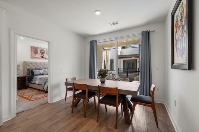 dining space featuring hardwood / wood-style flooring