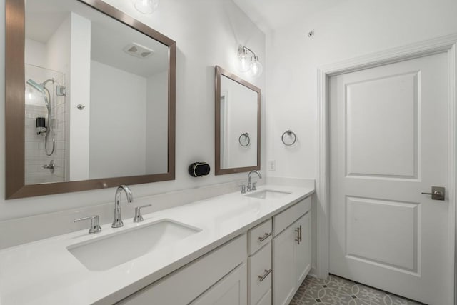 bathroom featuring vanity and a tile shower