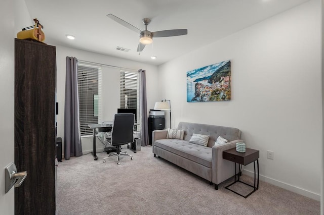 office area with light colored carpet and ceiling fan