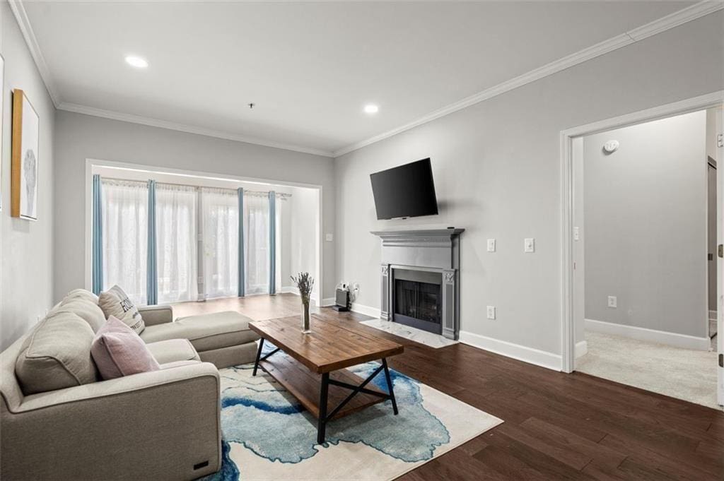 living room featuring crown molding and hardwood / wood-style flooring