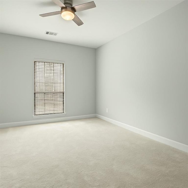 2865 Lenox Rd NE Unit 410, Atlanta, GA 30324 - unfurnished room with a ceiling fan, baseboards, visible vents, and light carpet