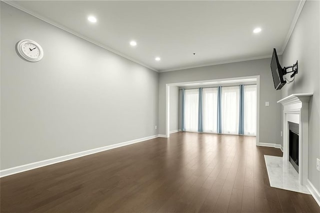 2865 Lenox Rd NE Unit 410, Atlanta, GA 30324 - unfurnished living room with crown molding, a premium fireplace, recessed lighting, baseboards, and dark wood-type flooring