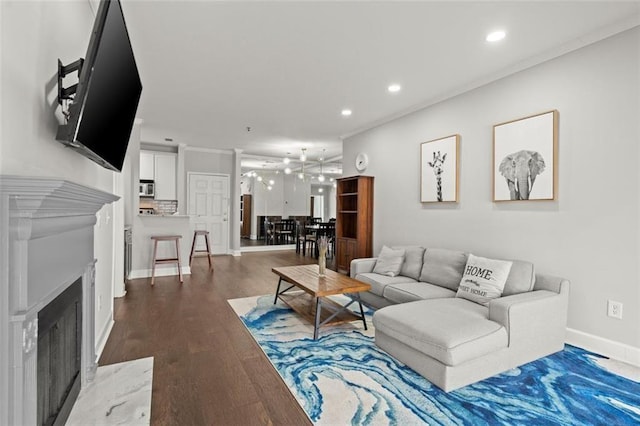 2865 Lenox Rd NE Unit 410, Atlanta, GA 30324 - living room featuring recessed lighting, baseboards, dark wood-style floors, and a fireplace with raised hearth