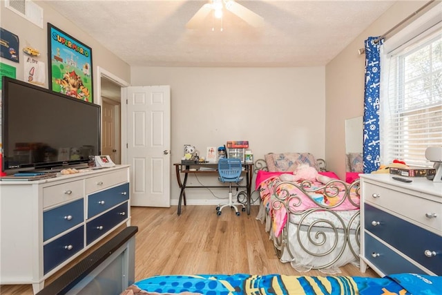 bedroom featuring ceiling fan and light hardwood / wood-style floors