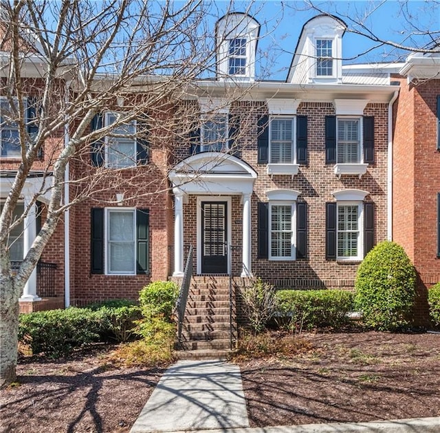 view of front of property featuring brick siding