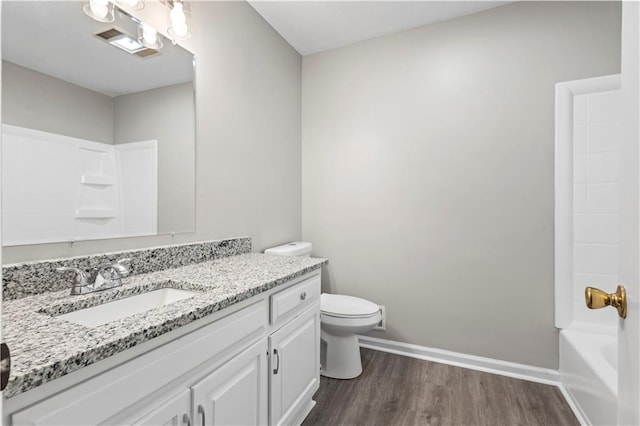 9438 Cedar Creek Pl, Douglasville, GA 30135 - bathroom featuring toilet, wood finished floors, vanity, visible vents, and baseboards