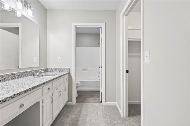 9438 Cedar Creek Pl, Douglasville, GA 30135 - full bathroom with vanity, toilet, shower / washtub combination, and baseboards