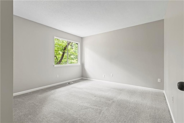 9438 Cedar Creek Pl, Douglasville, GA 30135 - unfurnished room with a textured ceiling, visible vents, baseboards, and carpet floors