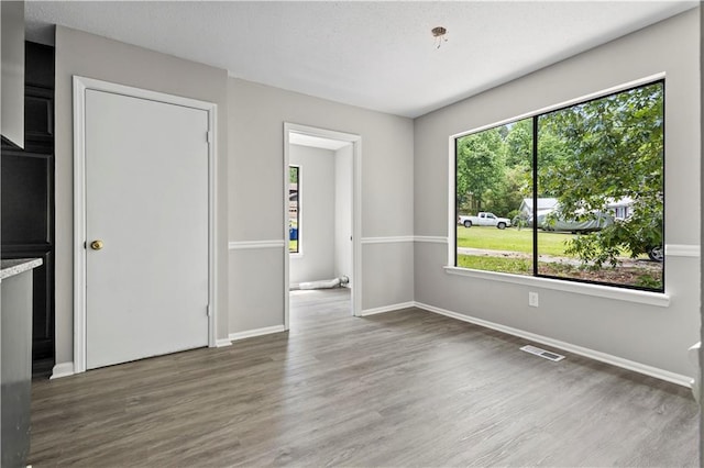 9438 Cedar Creek Pl, Douglasville, GA 30135 - interior space with visible vents, wood finished floors, and baseboards