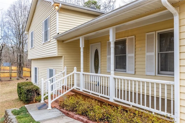 view of exterior entry with a porch