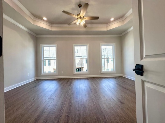 spare room with ornamental molding, dark hardwood / wood-style flooring, and plenty of natural light