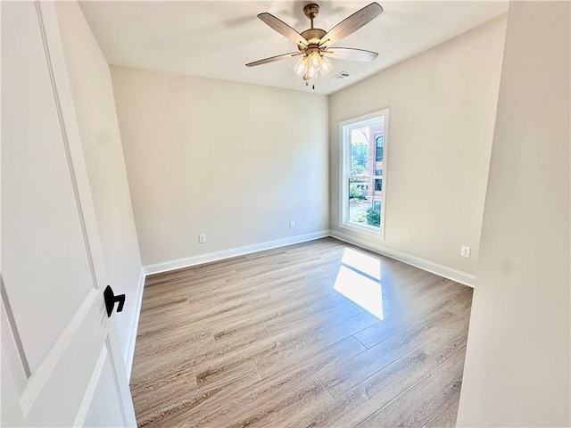 unfurnished room with light hardwood / wood-style flooring and ceiling fan