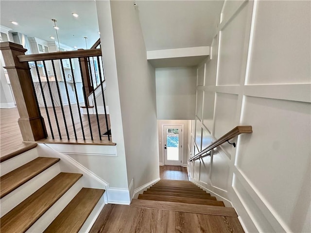 staircase featuring hardwood / wood-style flooring