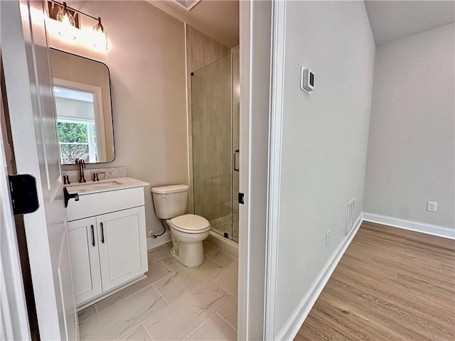 bathroom with vanity, toilet, an enclosed shower, and hardwood / wood-style flooring