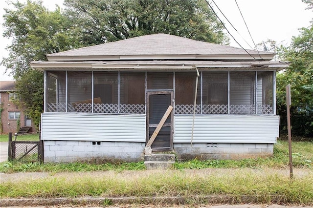 108 Vine St SW, Atlanta, GA 30314 - view of front of home featuring roof with shingles, a sunroom, and crawl space