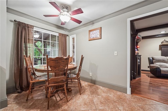 2030 Spring End Ct, Lawrenceville, GA 30044 - dining area with ceiling fan, tile patterned floors, baseboards, and ornamental molding