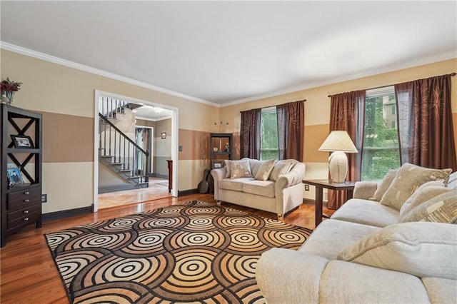 2030 Spring End Ct, Lawrenceville, GA 30044 - living room with wood finished floors, crown molding, stairway, and baseboards