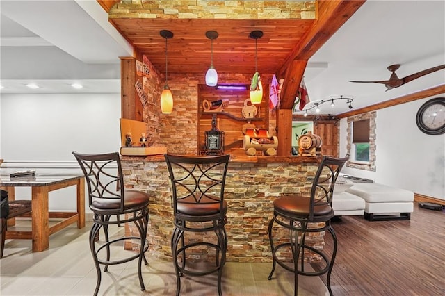 2030 Spring End Ct, Lawrenceville, GA 30044 - indoor dry bar with ornamental molding, wood finished floors, baseboards, decorative light fixtures, and ceiling fan