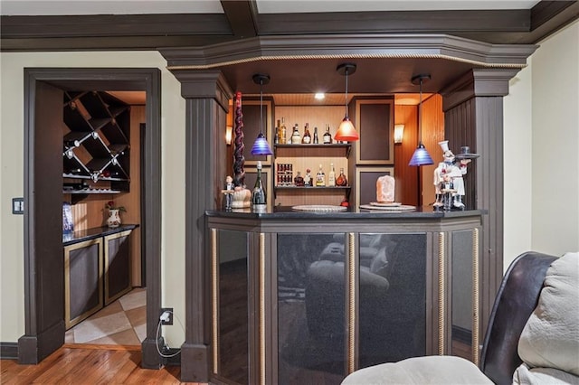2030 Spring End Ct, Lawrenceville, GA 30044 - indoor dry bar with wood finished floors, ornamental molding, and pendant lighting