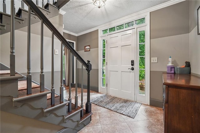 2030 Spring End Ct, Lawrenceville, GA 30044 - foyer entrance featuring stairs, ornamental molding, a textured ceiling, and tile patterned floors