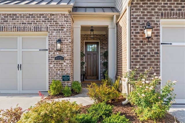 doorway to property featuring a garage