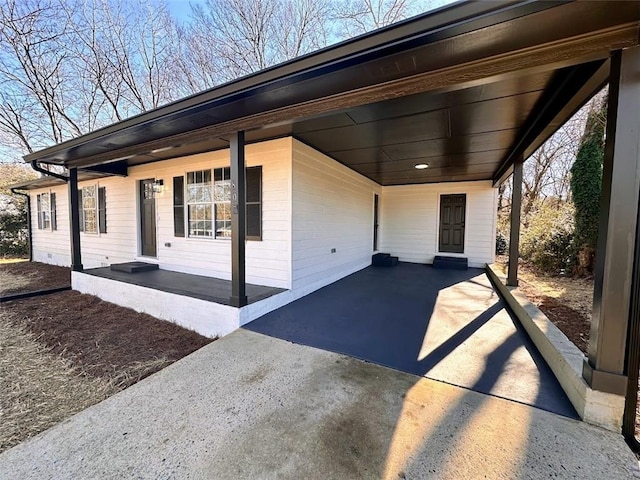 exterior space with a carport