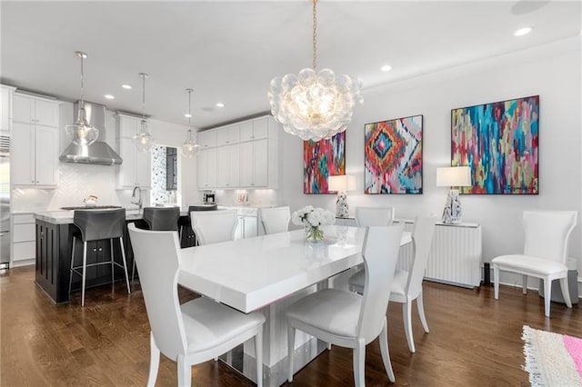 dining room with dark wood-style floors, a chandelier, recessed lighting, and radiator heating unit