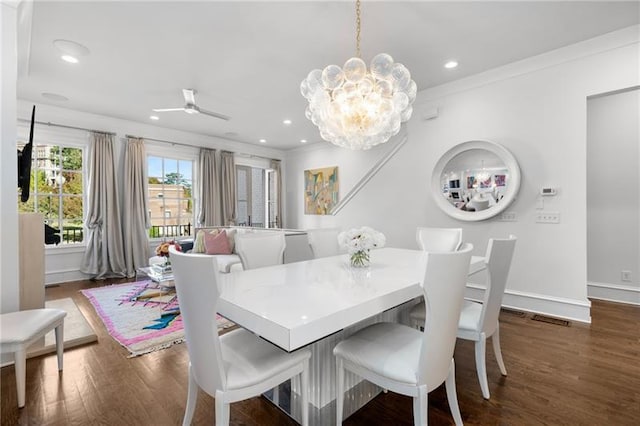 dining space featuring dark wood-style floors, recessed lighting, ornamental molding, a ceiling fan, and baseboards