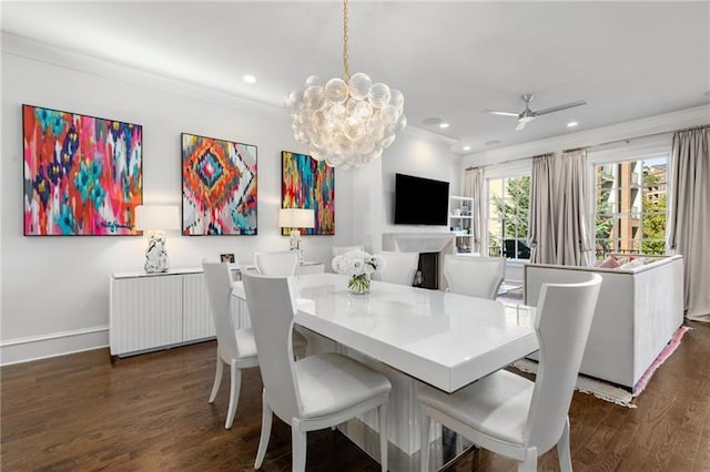 dining space featuring dark wood-style flooring, recessed lighting, ceiling fan, a chandelier, and baseboards