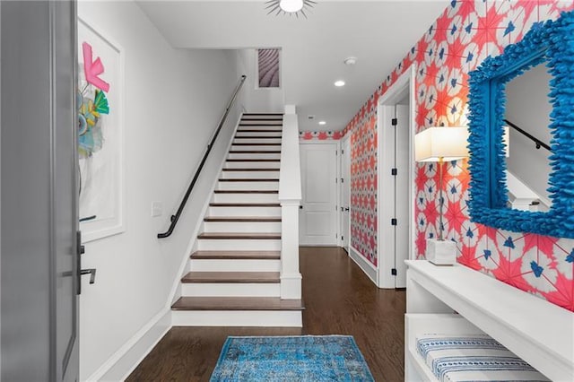 staircase featuring wallpapered walls, baseboards, wood finished floors, and recessed lighting