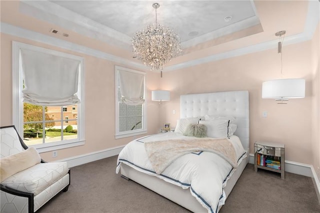 bedroom with carpet, a tray ceiling, baseboards, and ornamental molding