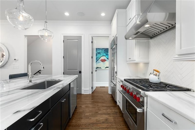 kitchen featuring white cabinets, high quality appliances, a sink, and exhaust hood