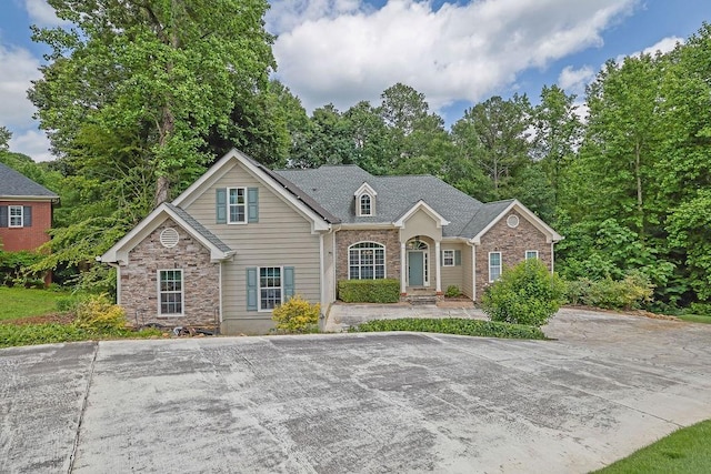 5581 River Valley Way, Flowery Branch, GA 30542 - traditional-style home featuring stone siding and brick siding