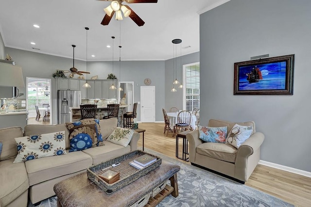 5581 River Valley Way, Flowery Branch, GA 30542 - living area featuring ceiling fan, light wood-style floors, crown molding, baseboards, and recessed lighting