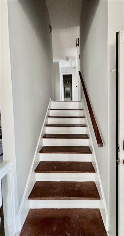 stairway with concrete floors