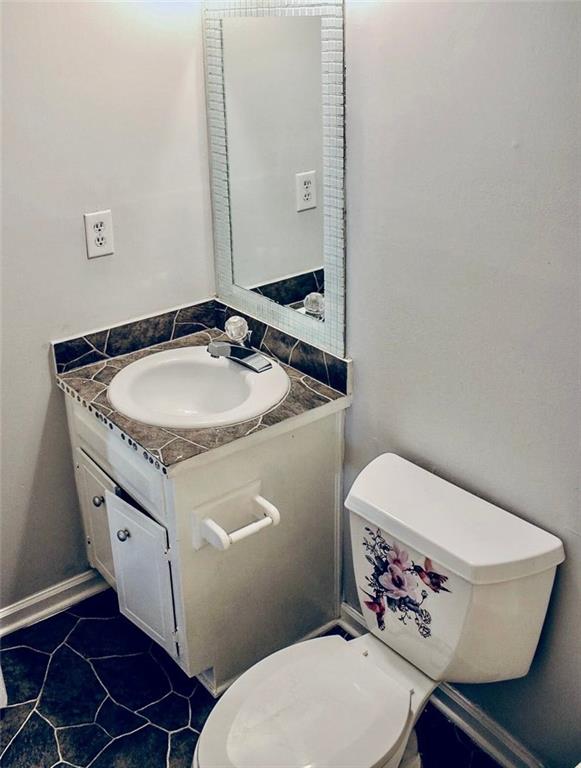 half bath with toilet and vanity
