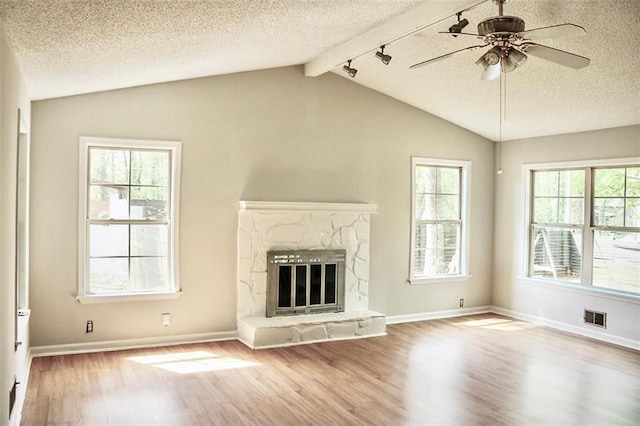 unfurnished living room featuring lofted ceiling with beams, visible vents, and wood finished floors