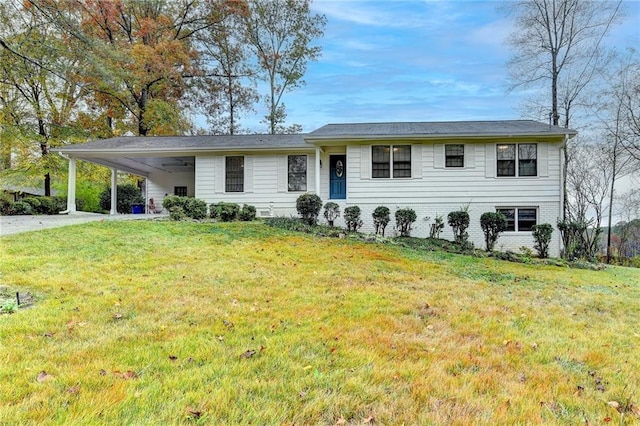 view of front of property with a carport and a front lawn