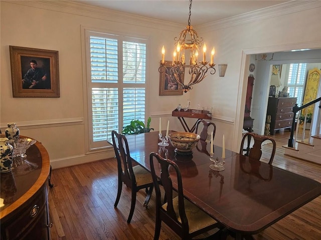 dining area with crown molding, stairway, wood finished floors, a chandelier, and baseboards