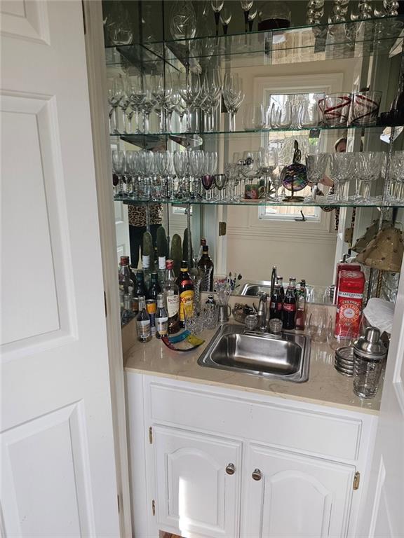 bar featuring a sink and wet bar