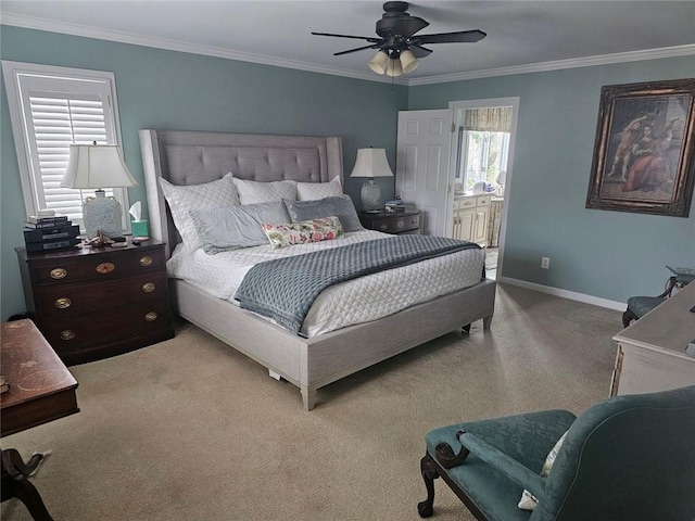 bedroom featuring connected bathroom, carpet flooring, a ceiling fan, baseboards, and crown molding