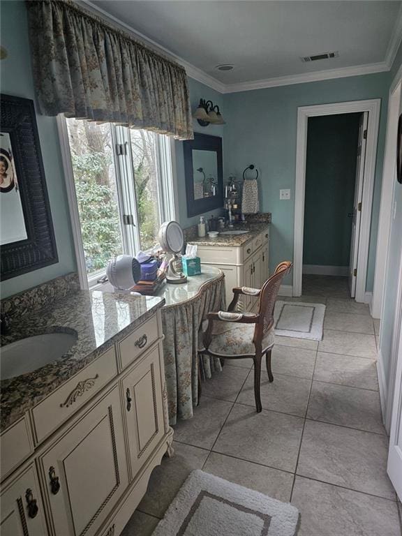 dining room with light tile patterned floors, baseboards, visible vents, and crown molding